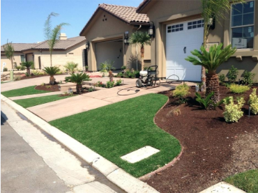 Rockledge Florida homes with recent work done laying fake grass near driveways for an HOA.